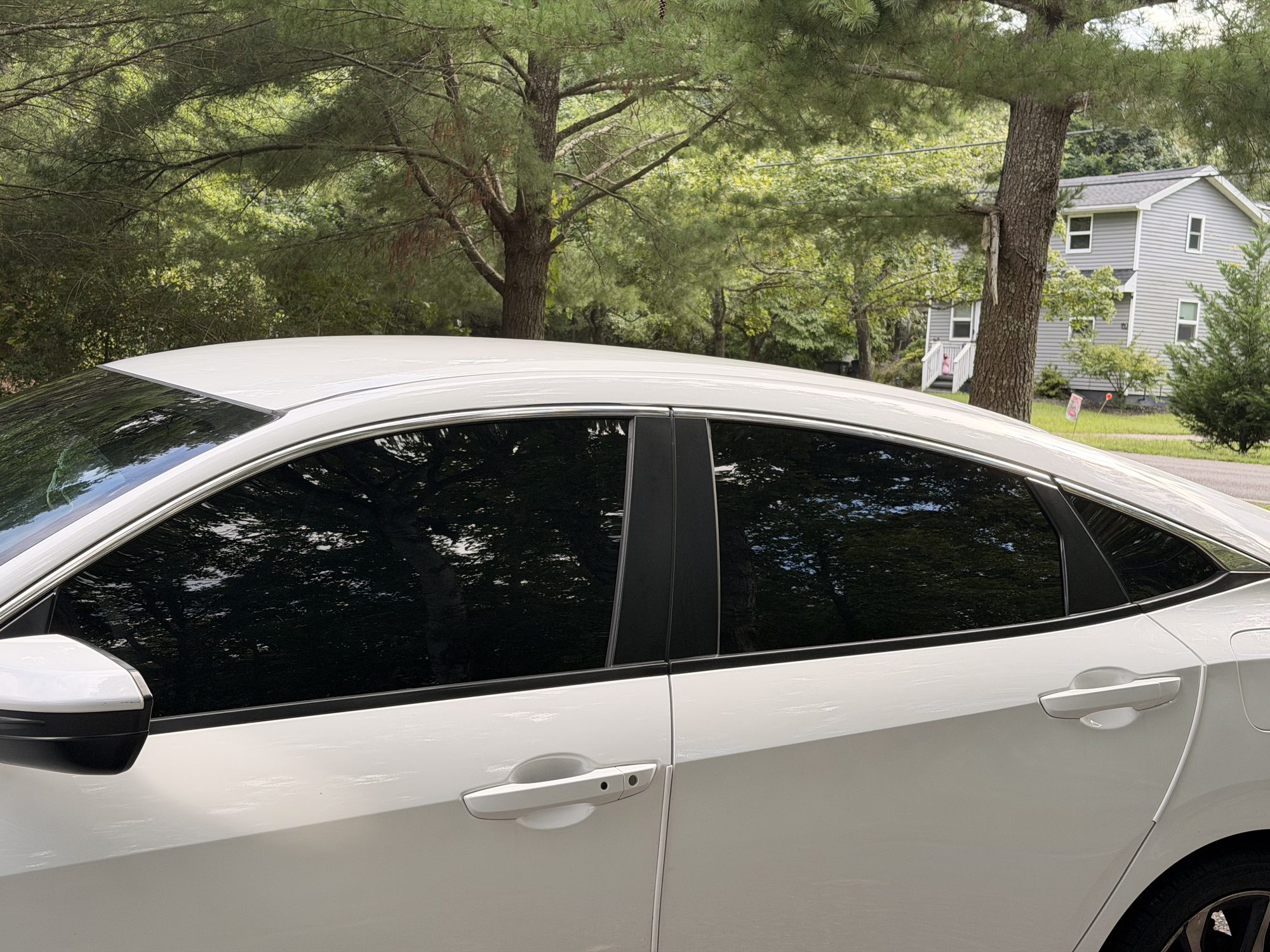 Close-up of ceramic tint on a rear door window