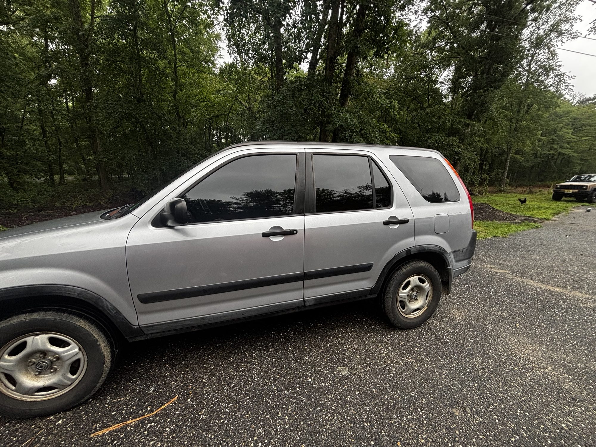 Honda CR-V SUV with full ceramic window tint, side profile