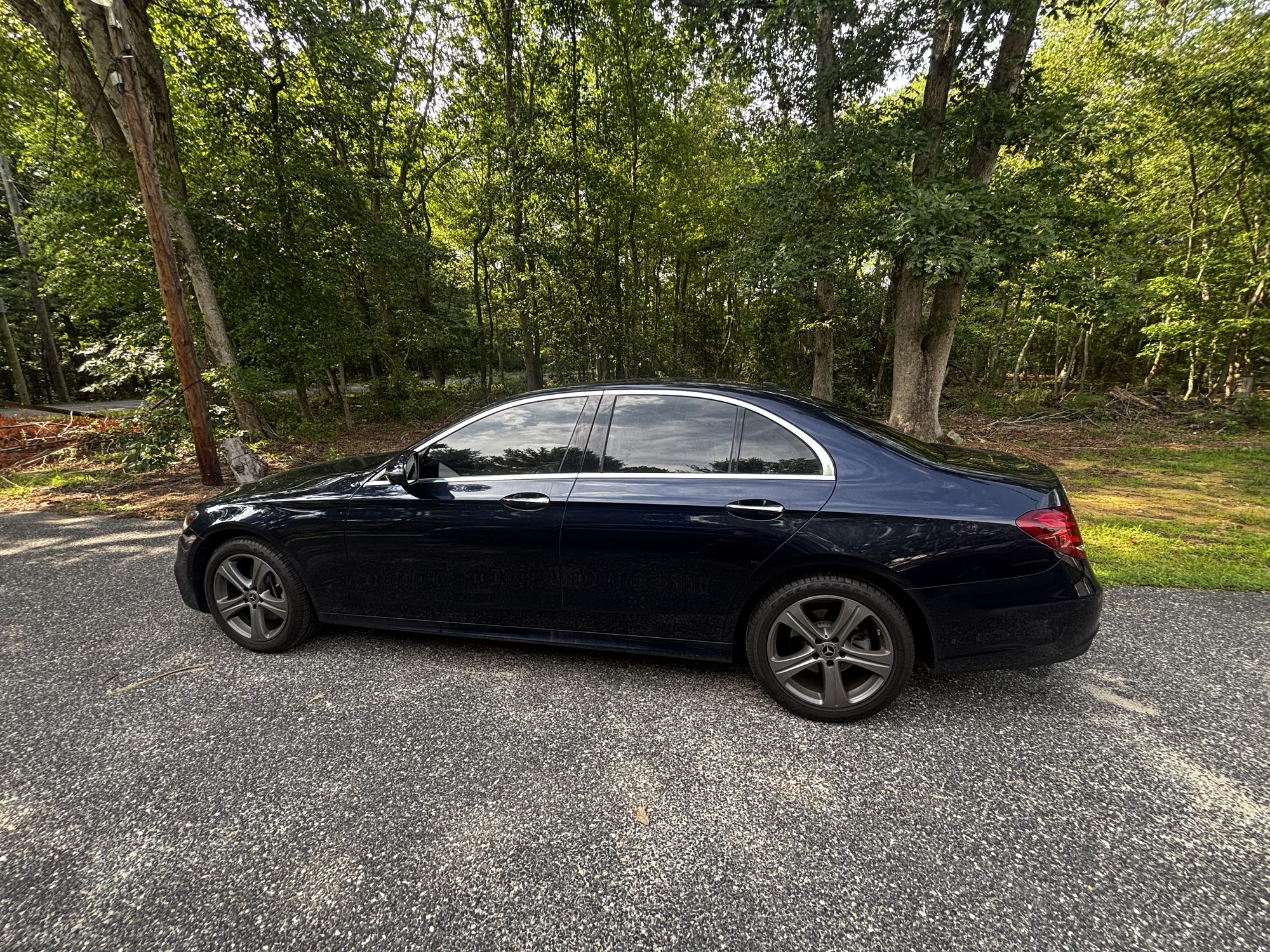 Mercedes-Benz sedan with full ceramic window tint, side profile