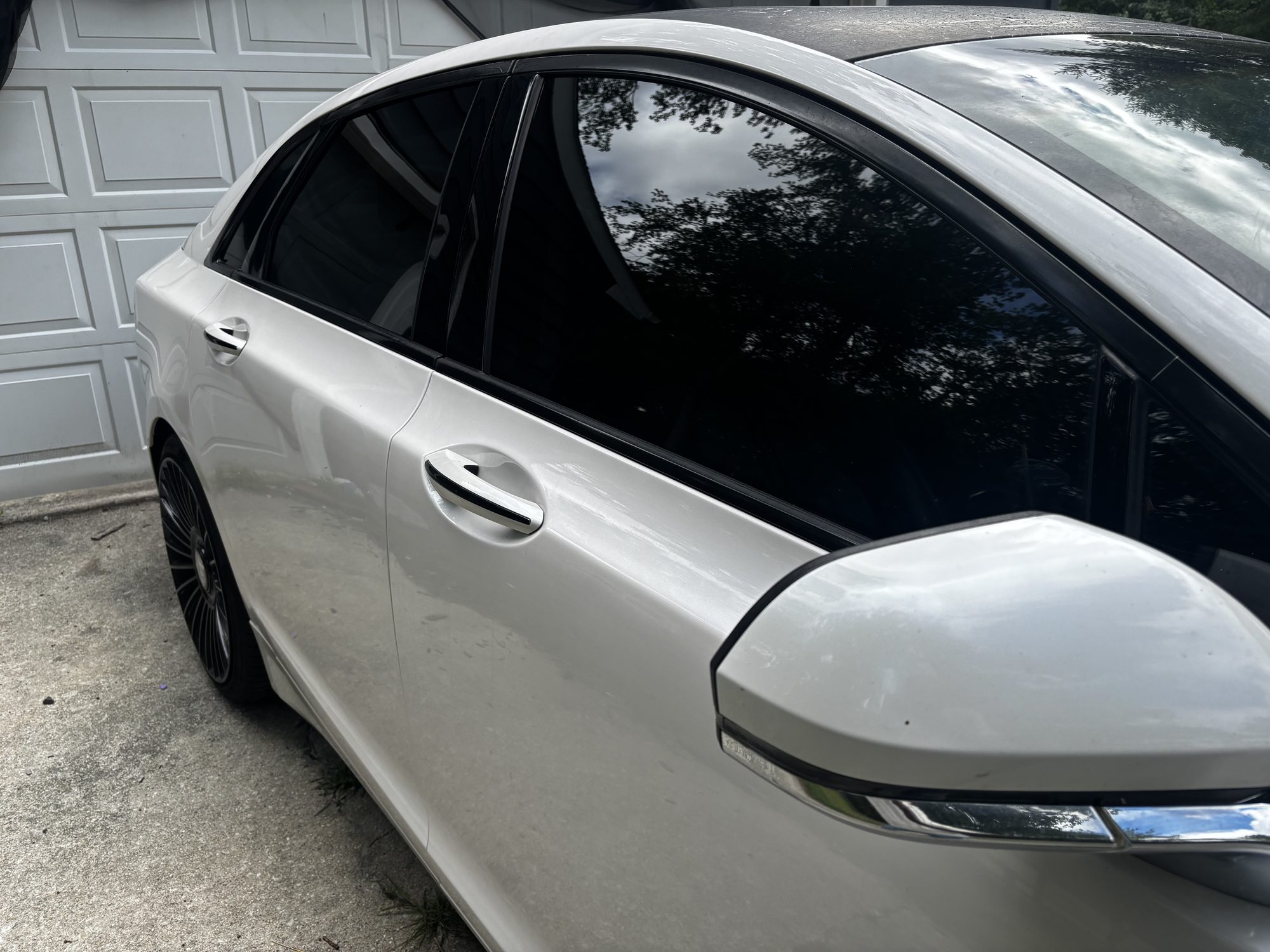 Close-up of ceramic-tinted window and side mirror