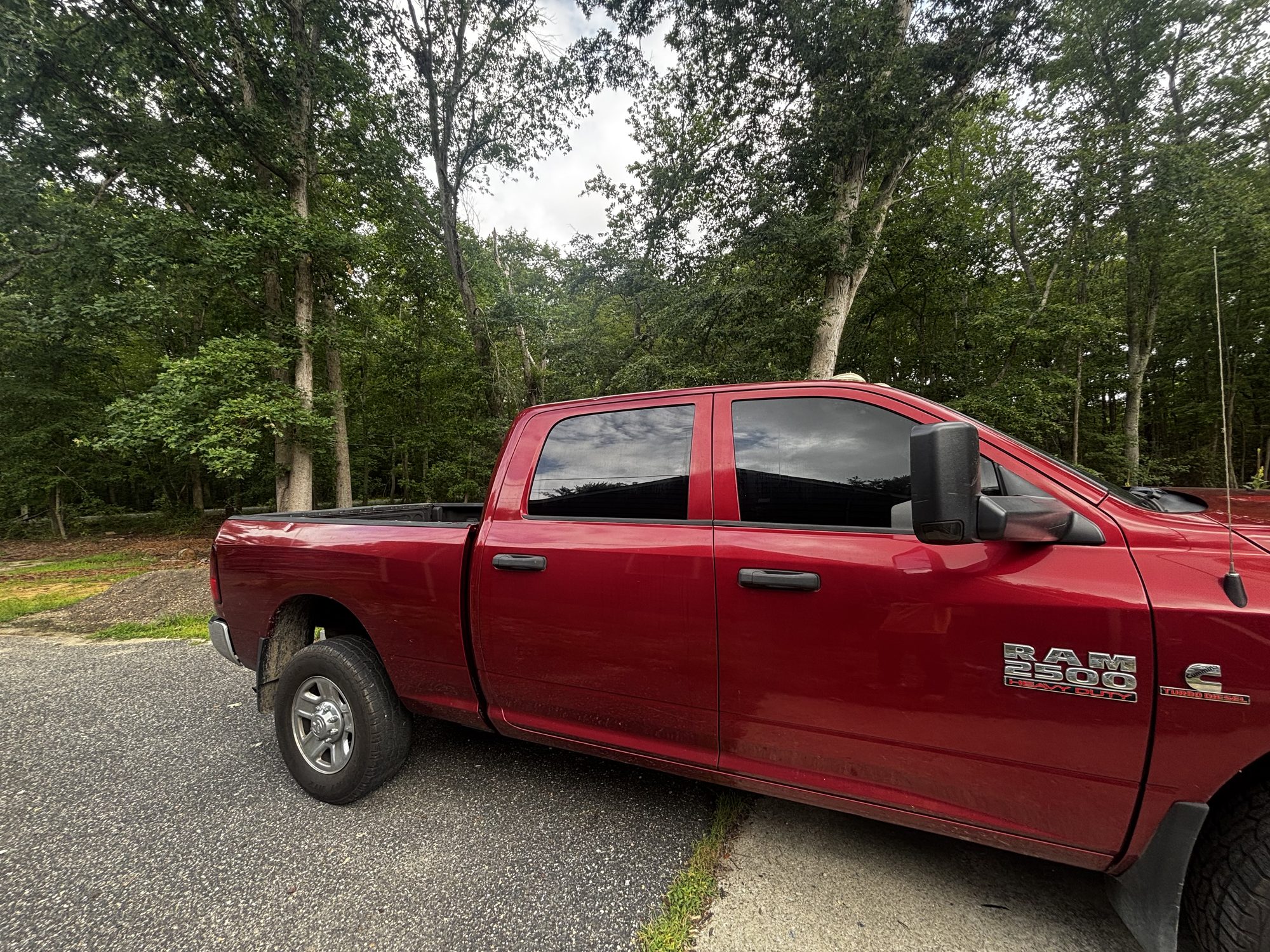 Ram 2500 pickup with full ceramic window tint, side profile