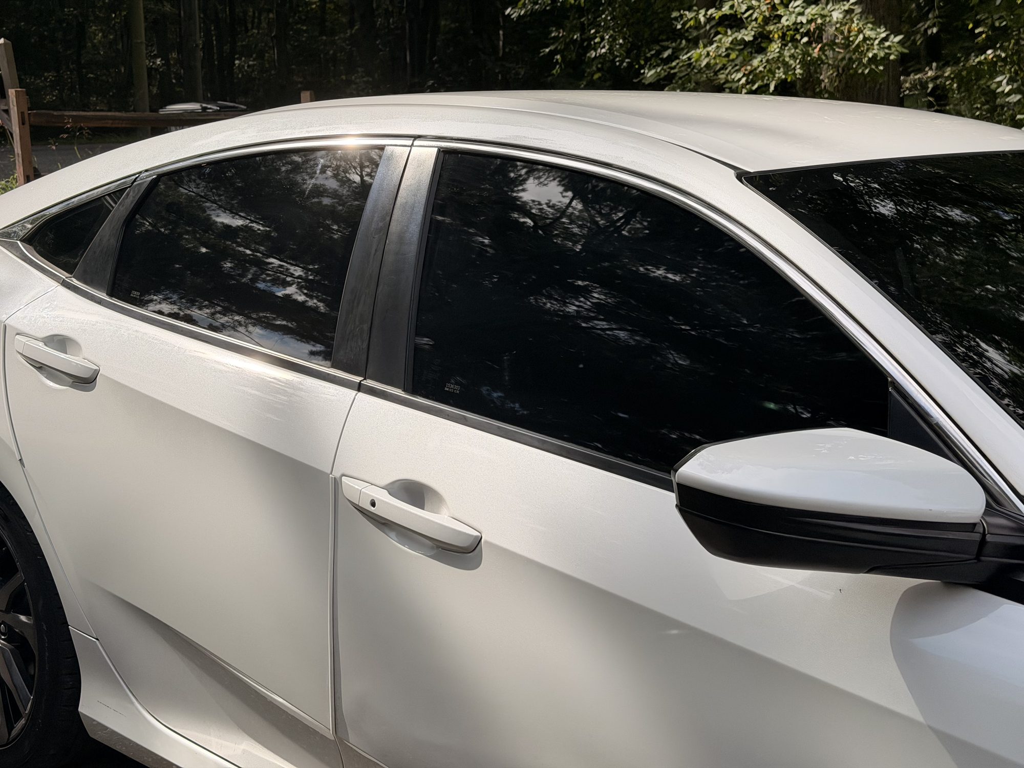 Close-up of ceramic tint on a rear quarter window